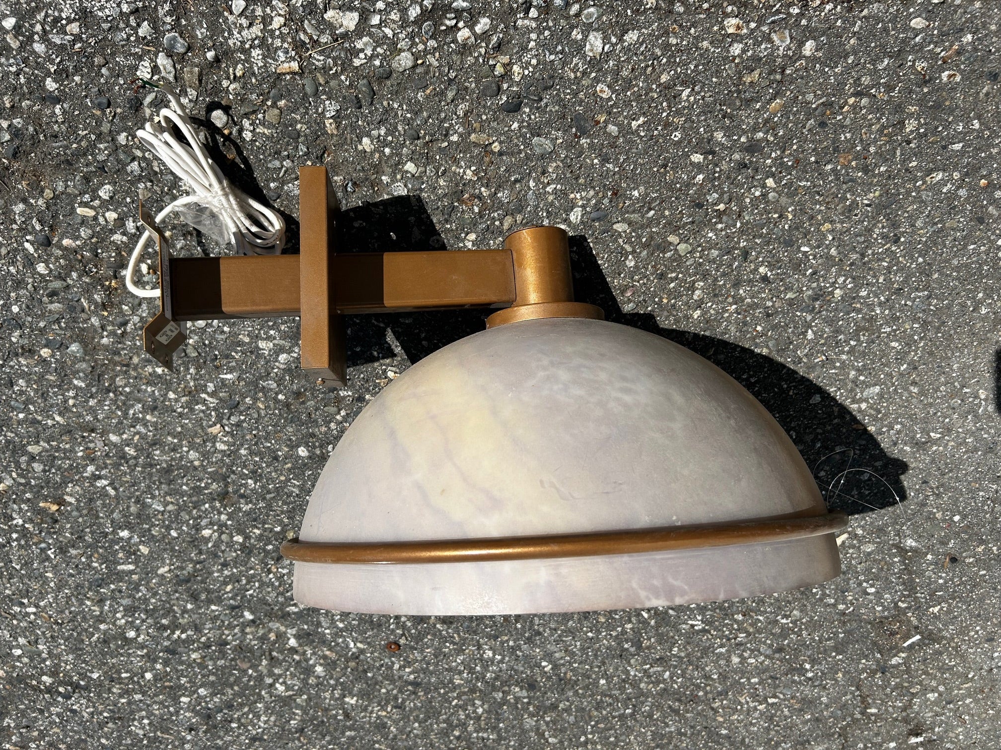 Old gold painted outdoor wall sconces with acrylic dome shades