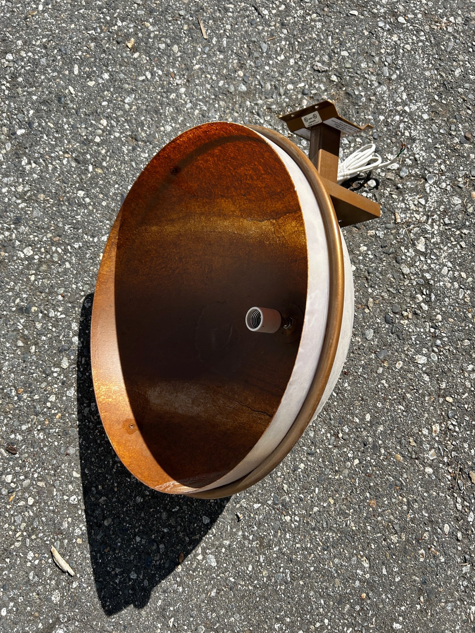 Old gold painted outdoor wall sconces with acrylic dome shades