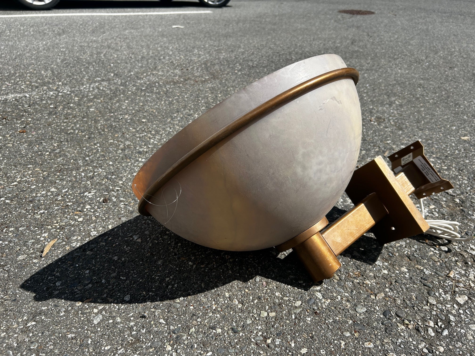 Old gold painted outdoor wall sconces with acrylic dome shades